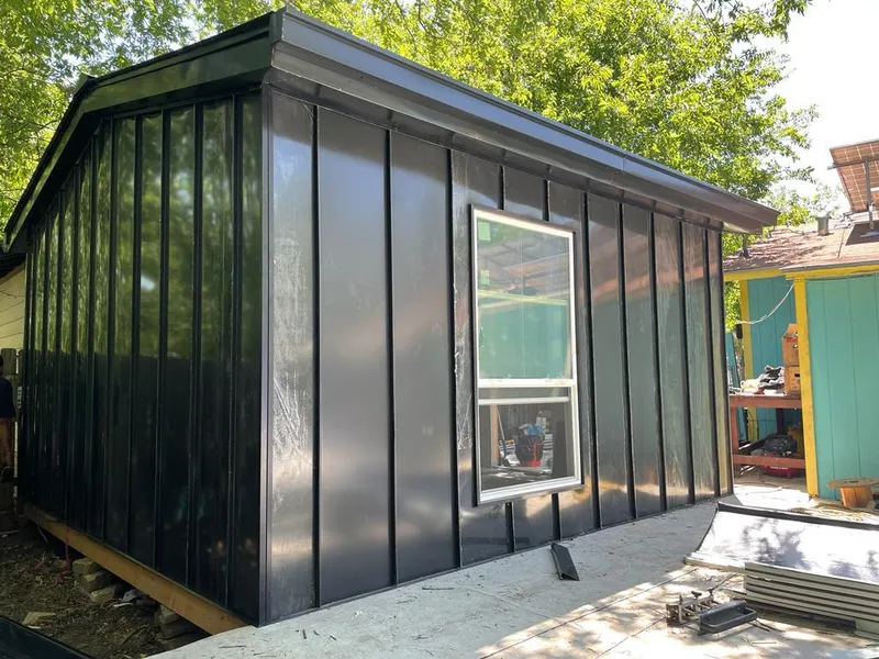 Black standing seam metal wall panels for Roof Inspection in Carthage